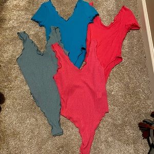 Lot of 4 Shein bodysuits. Size Small
